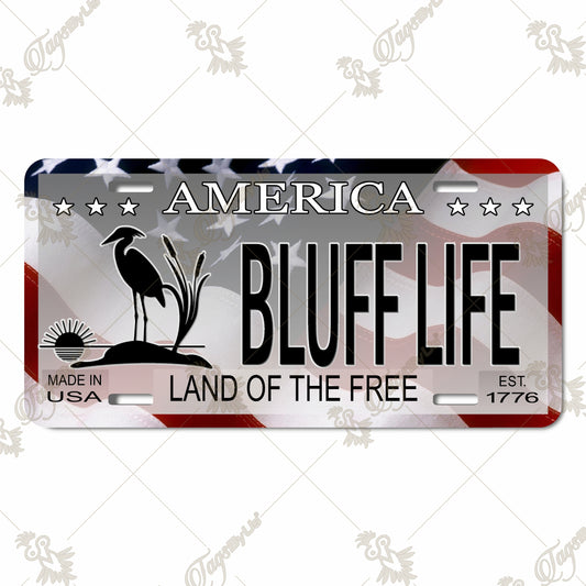 Bluff Life Aluminum License Plate – Patriotic Sublimation Design with Heron Silhouette, American Flag, and 'Land of the Free' Motto